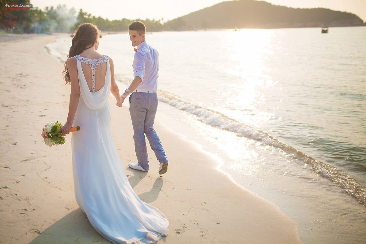 Sunset beach walk after ceremony — romantic moment from wedding day photoshoot