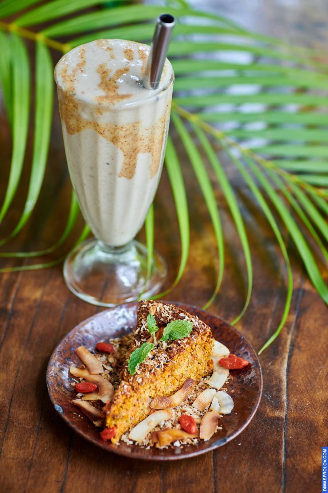 Naturally lit, life-style shot of a milkshake and a slice of cake, perfect for cafes and dessert shops aiming for a real and appealing Instagram feed