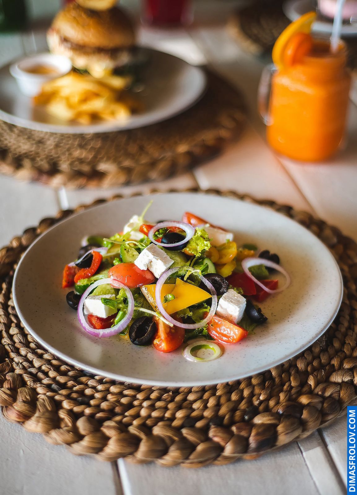 Naturally lit, life-style shot of a vibrant salad with cheese, perfect for health and wellness bloggers and restaurants emphasizing fresh ingredients