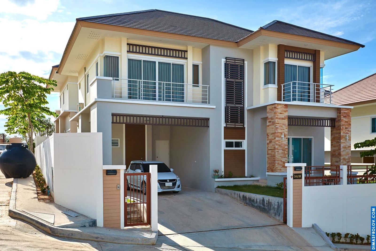 Exterior of a modern hotel villa: stylish architecture with private parking