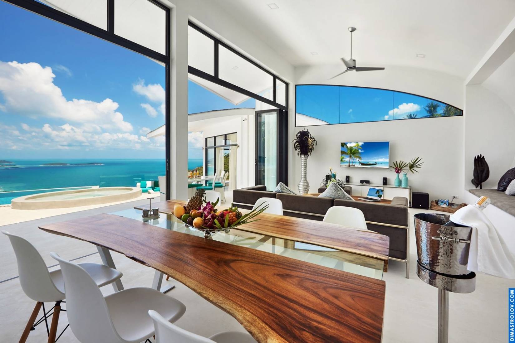 Modern hotel suite interior: bright open space with sea view and contemporary design