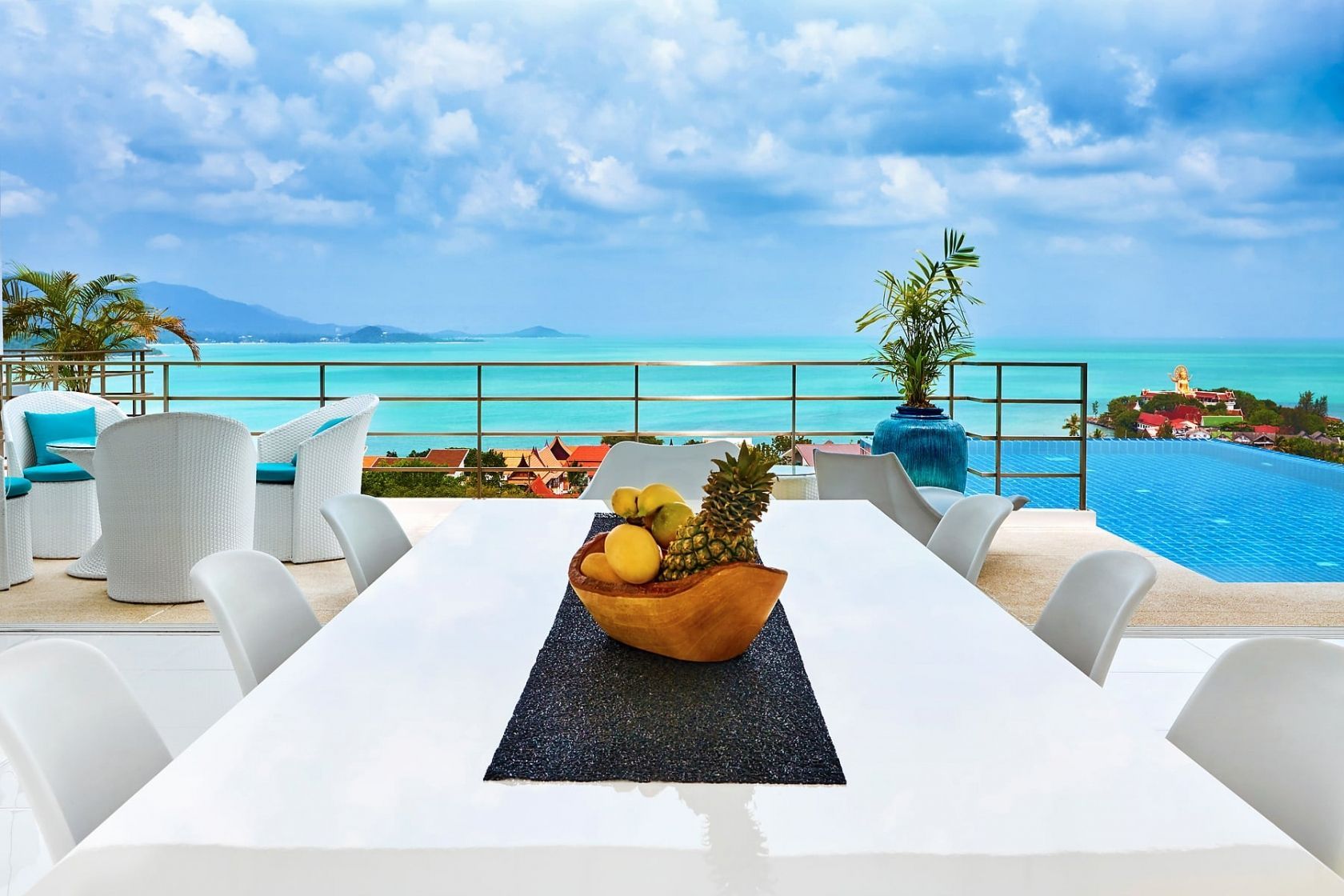Luxury resort dining: elegant outdoor table setting with ocean view