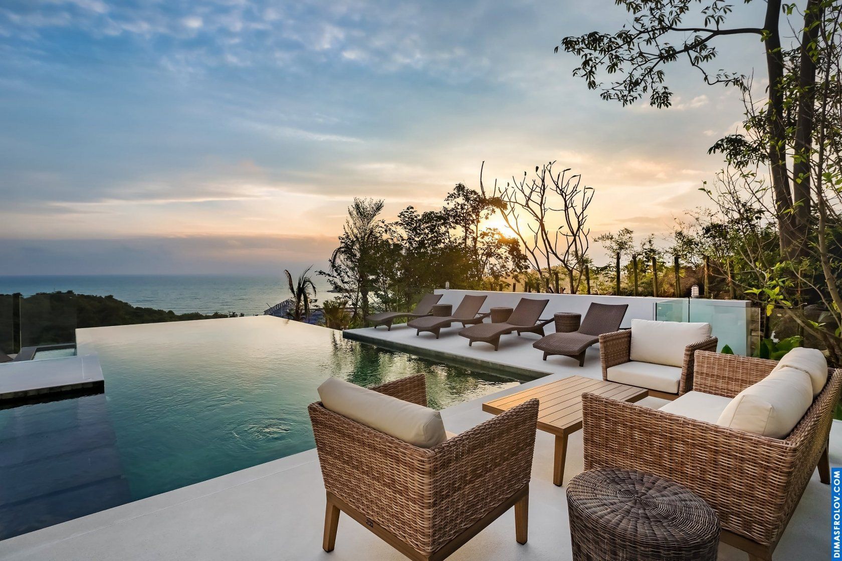 Luxury hotel infinity pool: stunning ocean view from a stylish lounge area