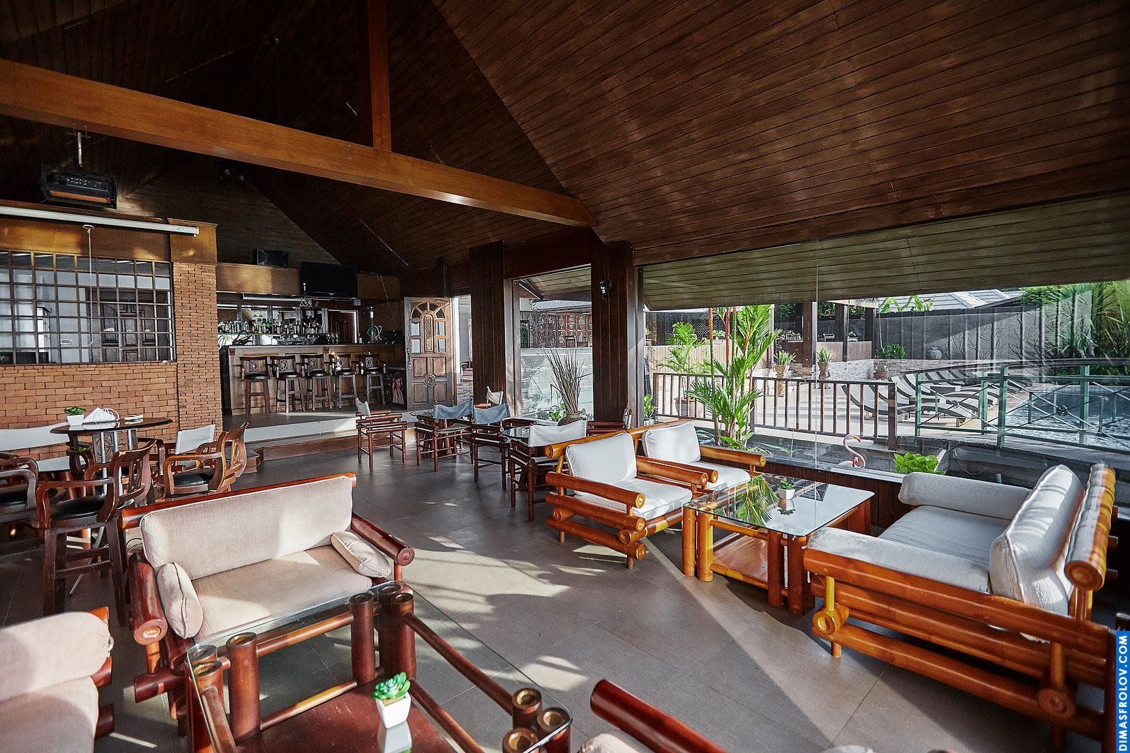 Hotel restaurant interior: stylish dining area with natural light and modern decor
