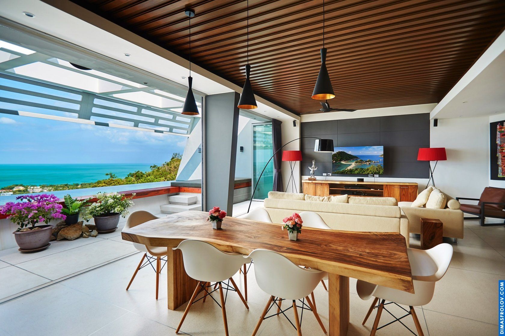 Luxury hotel dining area: stylish table setting with panoramic ocean views