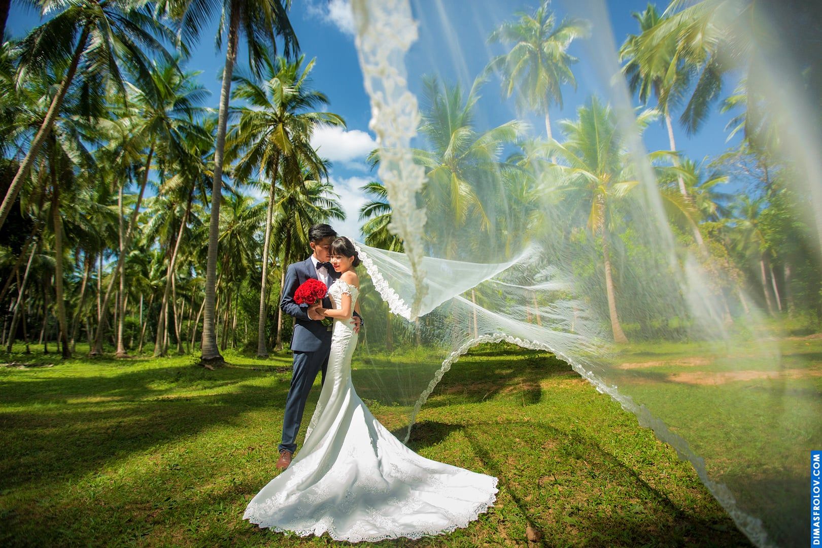 Flying veil and tropical greenery — elegant outdoor wedding photoshoot