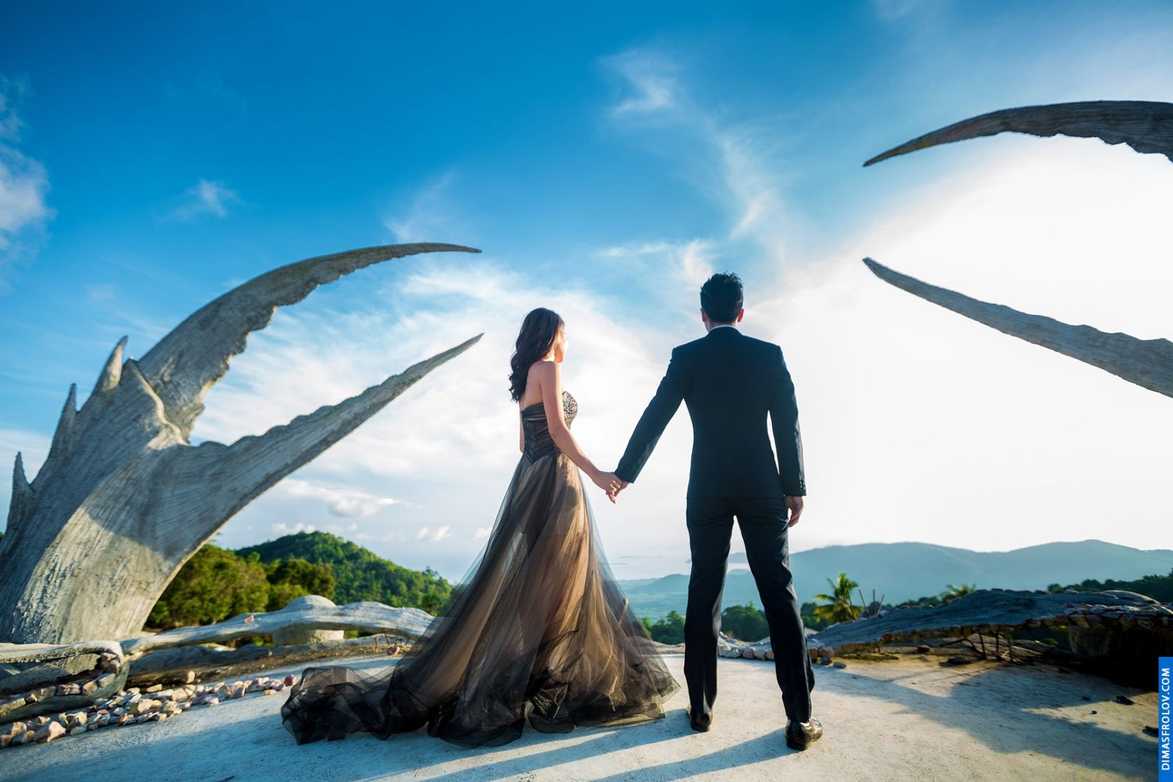 Fashion-style wedding shoot in dramatic landscape with bold dress and view
