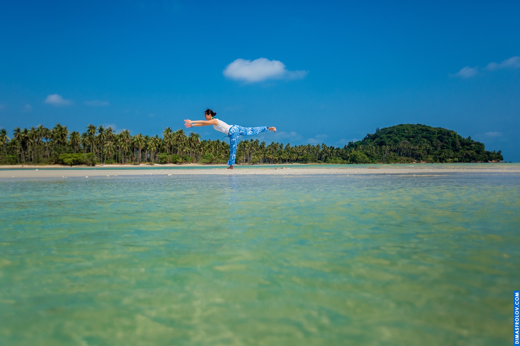 Idyllic tropical beach: calm turquoise water lapping a white sandy shore