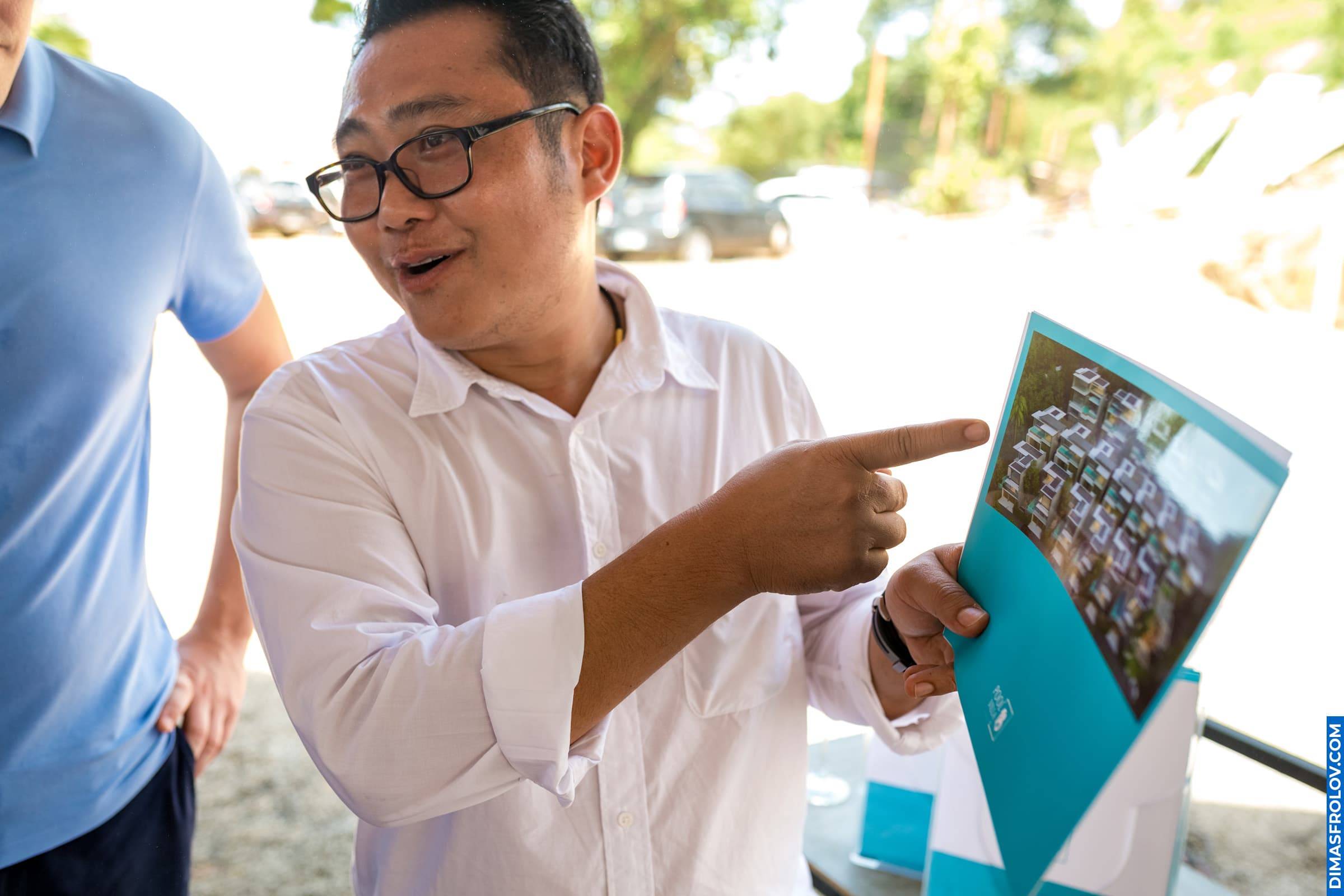 Speaker explaining masterplan to guests during real estate project showcase