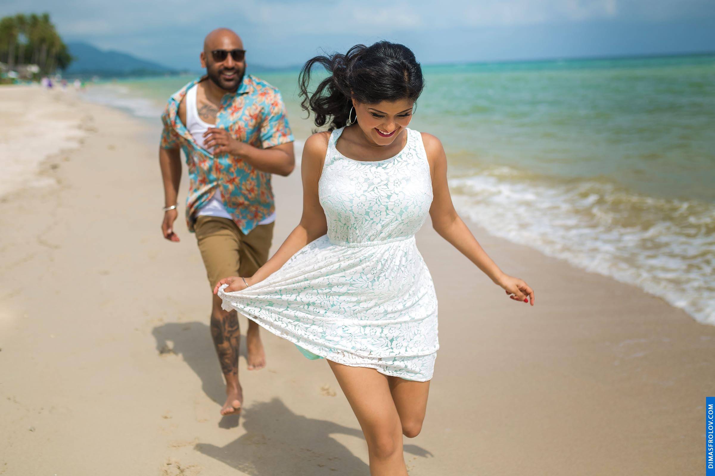 Joyful engagement photo session on a quiet tropical beach
