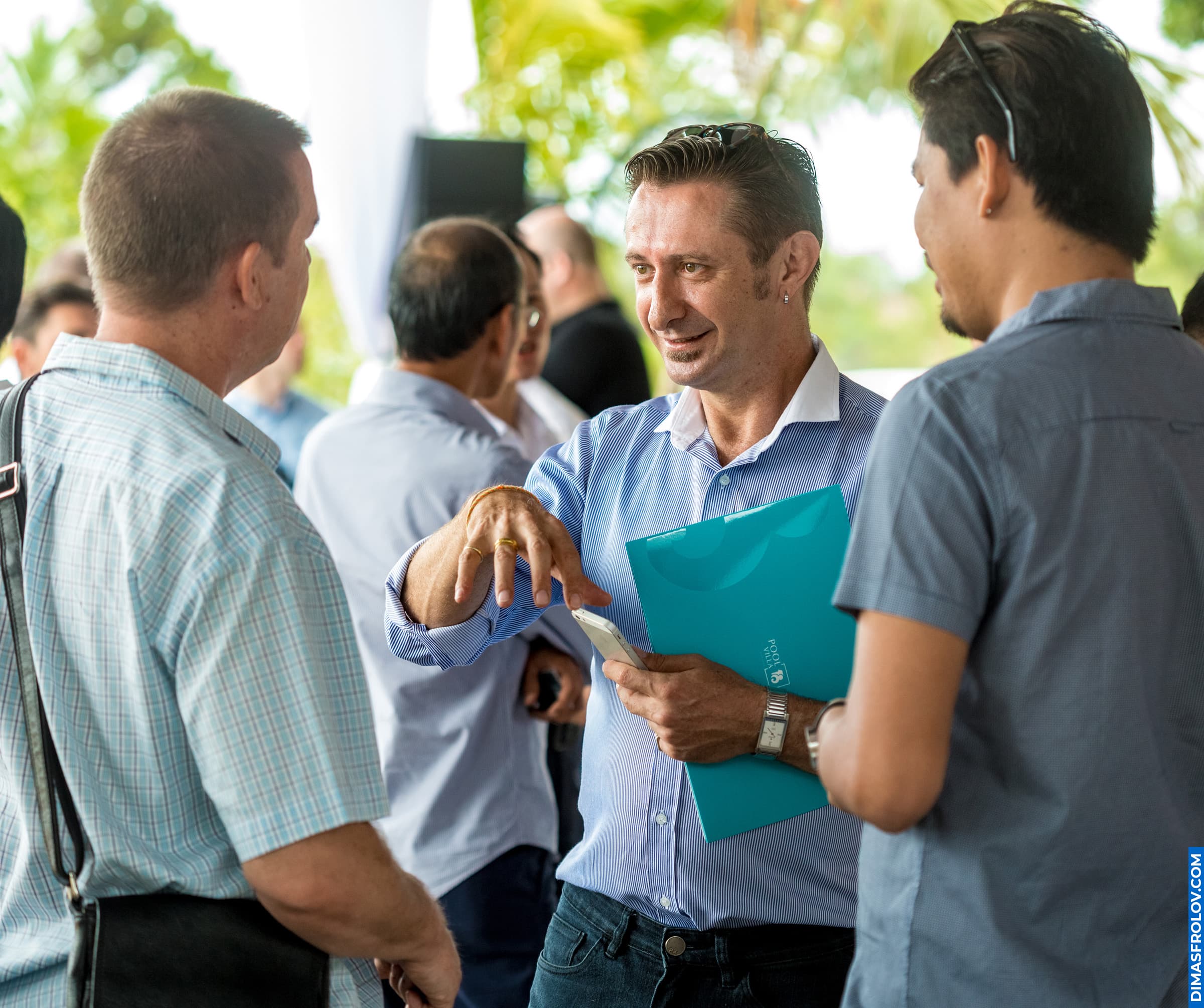 Real estate agents and developers exchanging contacts during property event