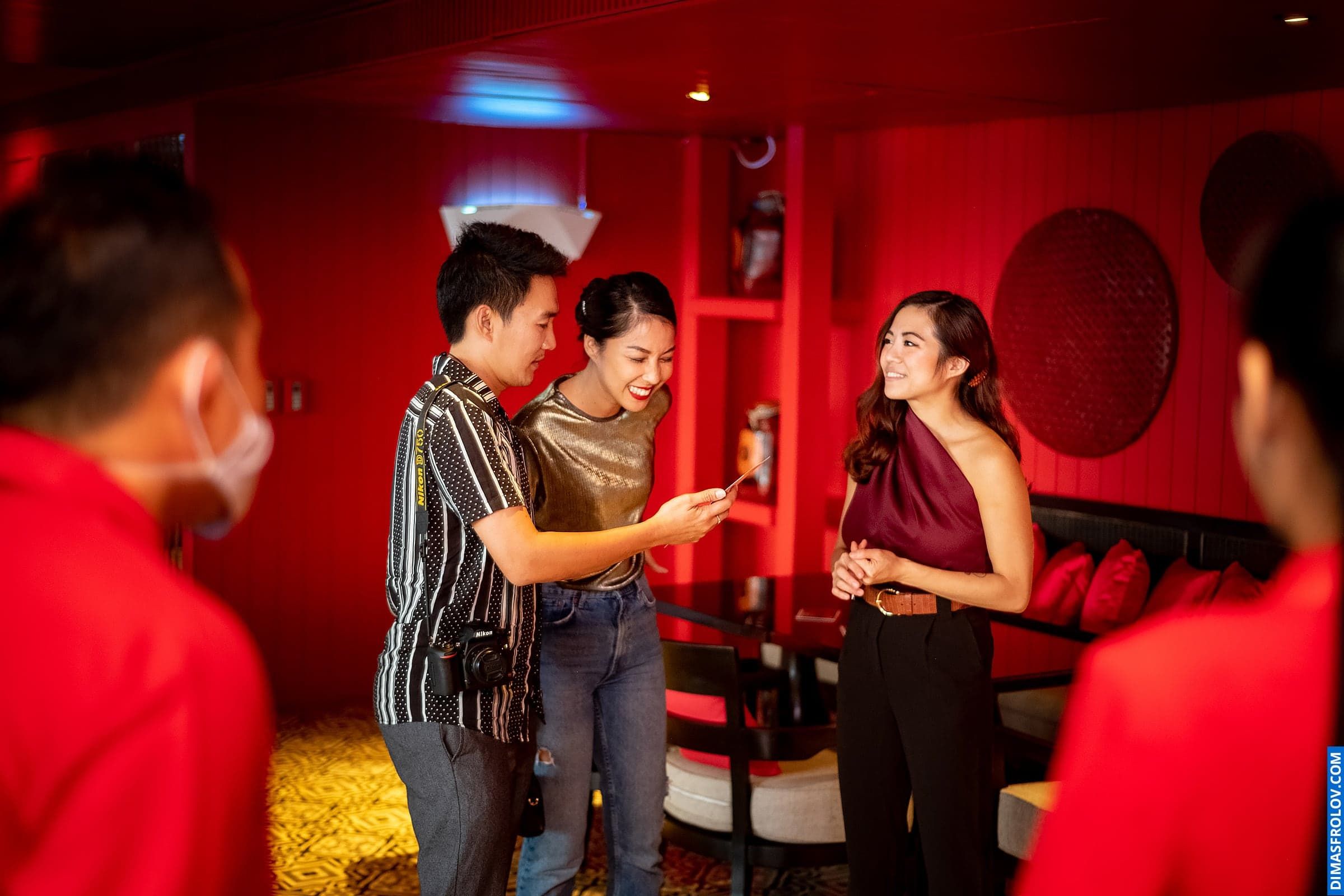 Lively party at stylish bar — people toasting and enjoying the evening