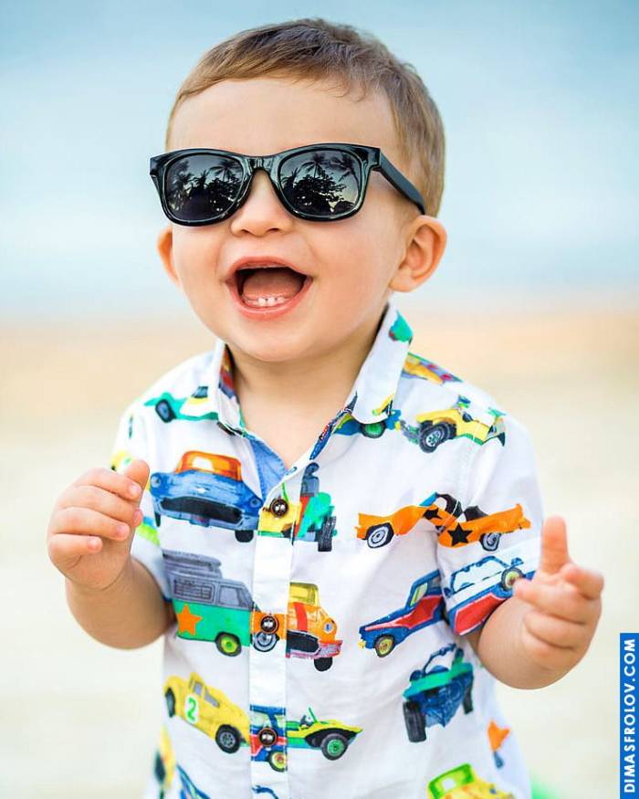 Cool baby portrait on the beach — stylish and playful kids photo shoot