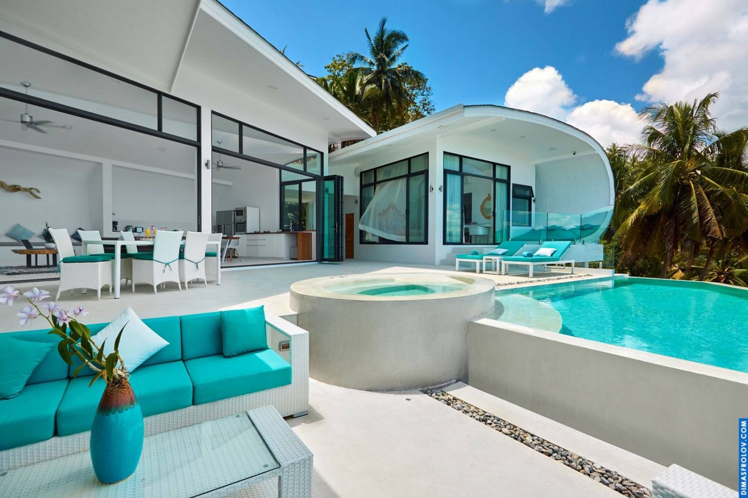 Bright villa terrace: stylish outdoor furniture and infinity pool with ocean view