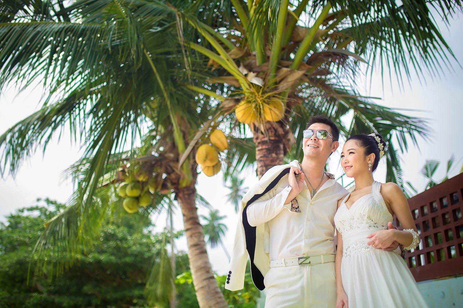 Koh Samui Wedding Photographer. Wedding Chinese couple look at the skyline with coconut background on Koh Samui Dimas Frolov. Koh Samui Photographer. DimasFrolov.com