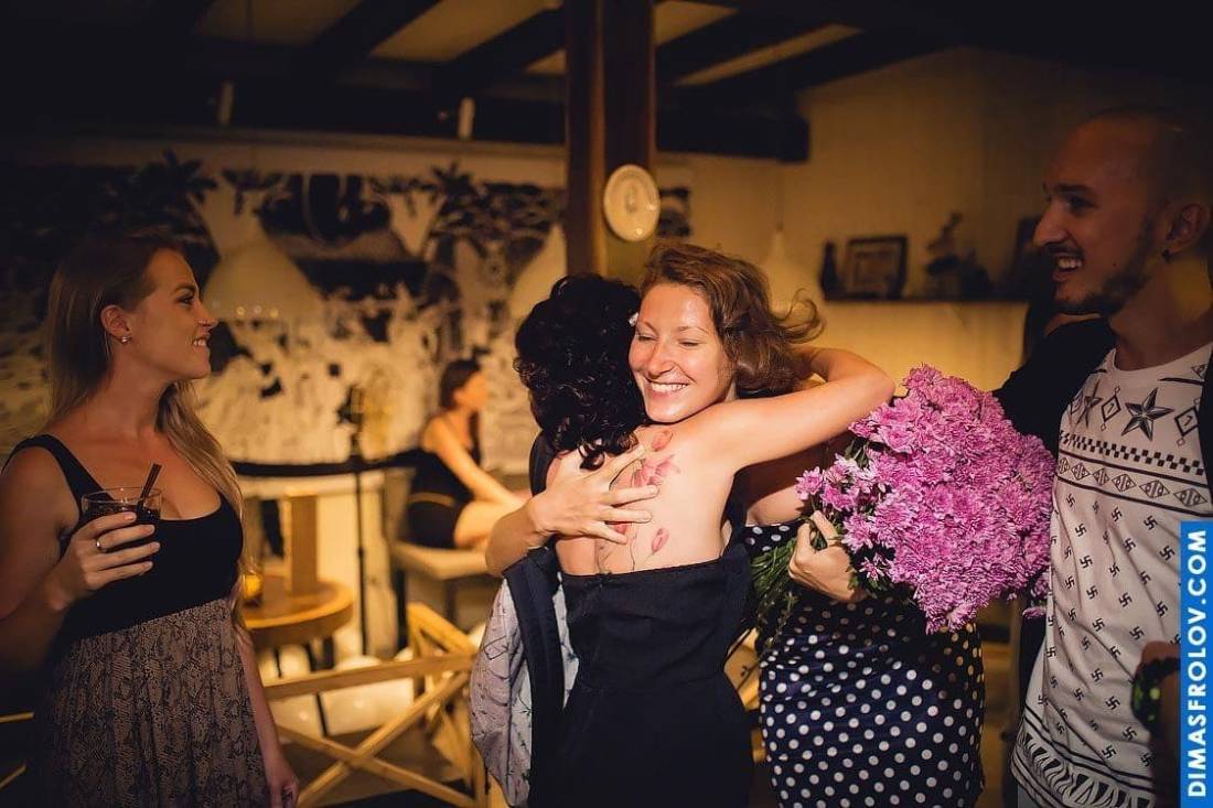 Warm hugs and flowers during restaurant birthday celebration