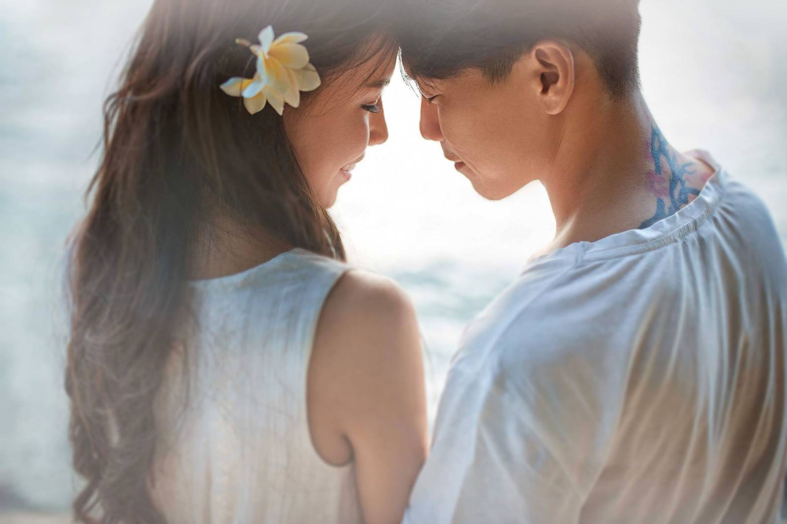 Romantic portrait by a Koh Samui photographer capturing an affectionate moment between a couple