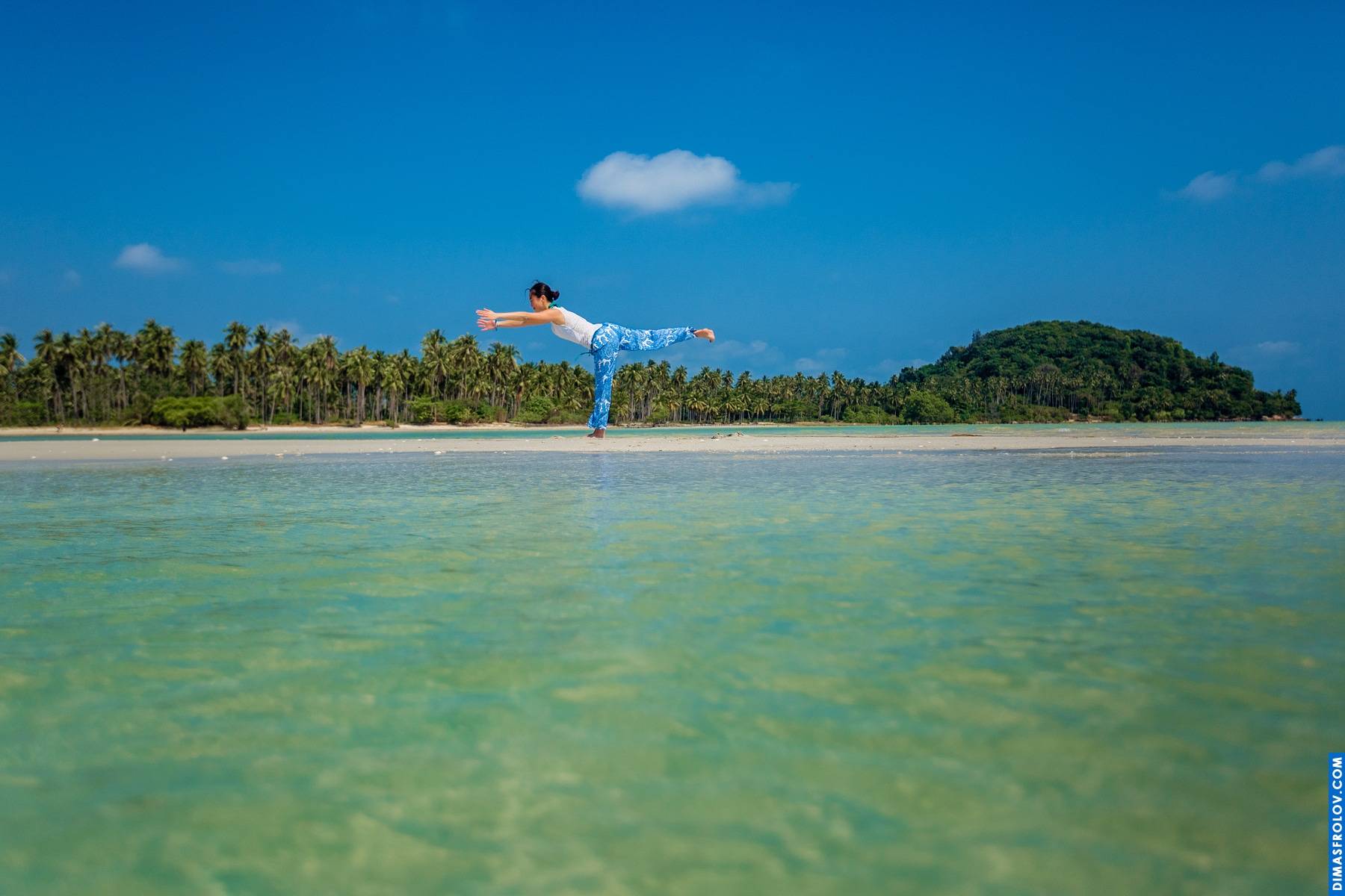 Idyllic tropical beach: calm turquoise water lapping a white sandy shore