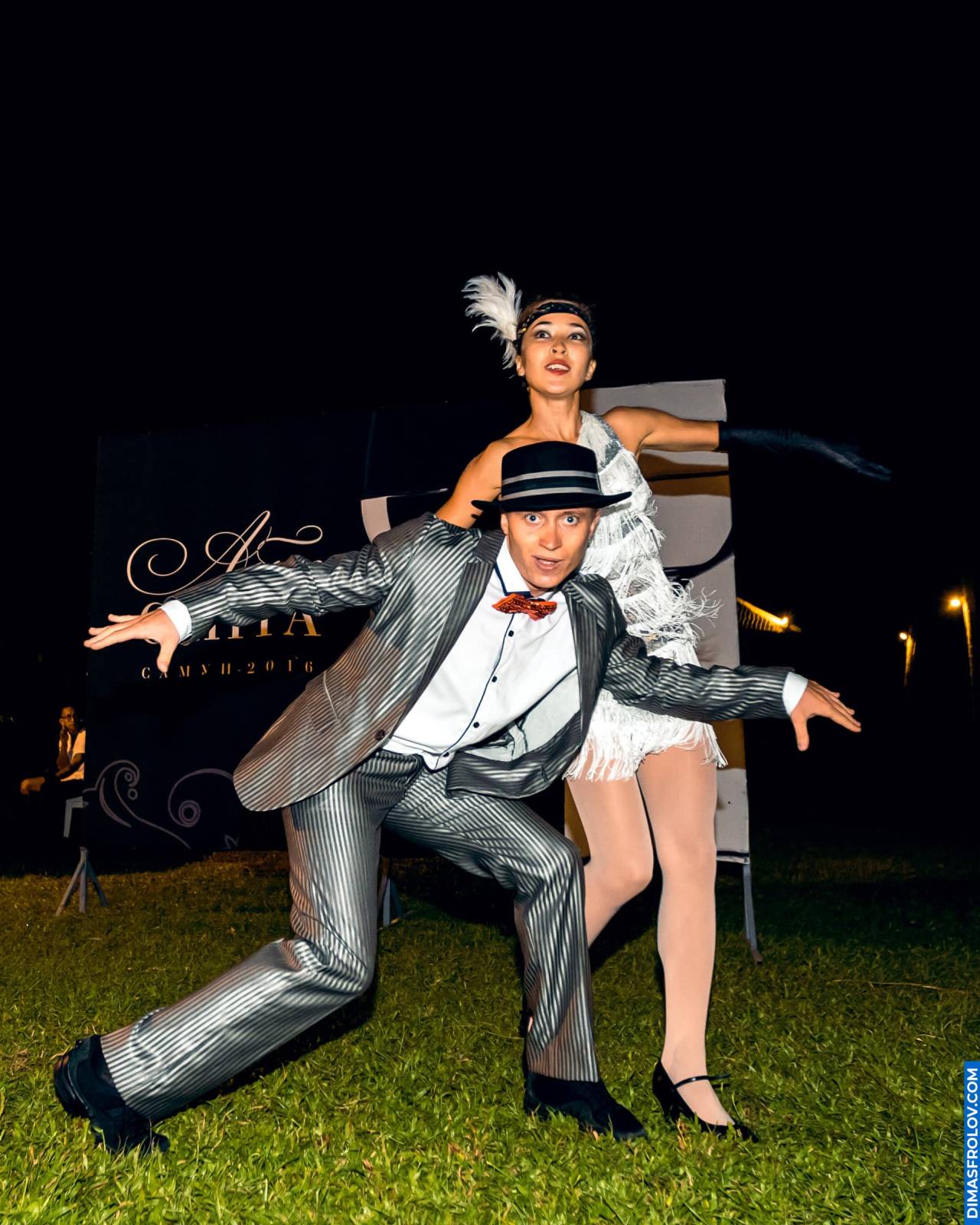 Themed dance performance at restaurant birthday — glamorous retro costumes
